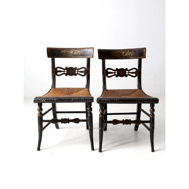 This is a stunning pair of 19th century stencil painted side chairs. The Hitchcock style chairs are characterized by their...