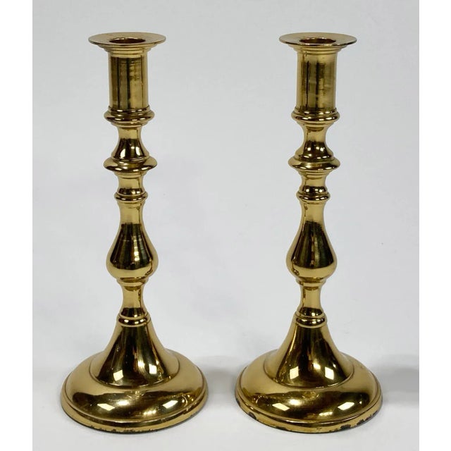 Pair of heavy brass candlestick holders. Unmarked by maker, but reminiscent of Baldwin. Lovely patina.