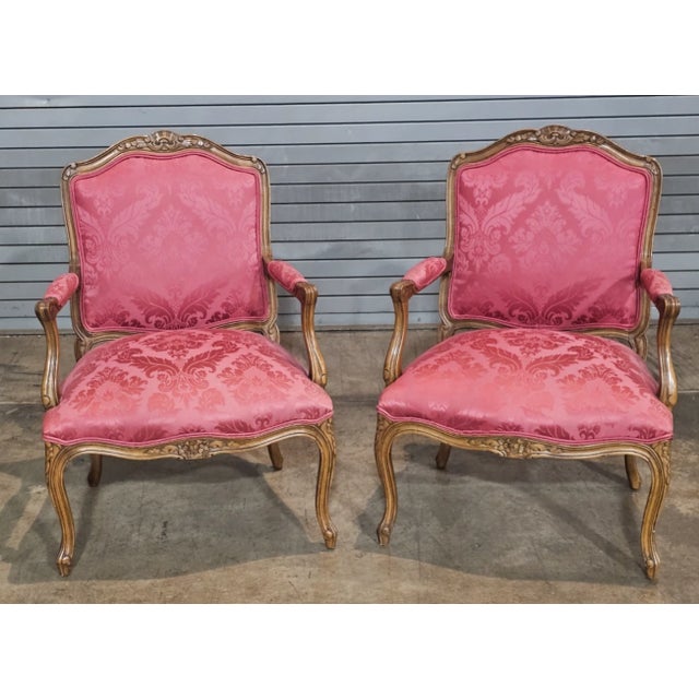 Store Item: Pair Provincial French Country Walnut Carved Arm Chairs Rose Silk Damask Fabric Description: Chairs feature a...