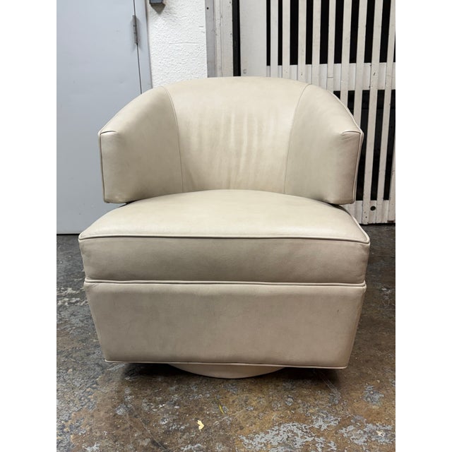 Design Plus Gallery presents the Sherman Swivel Chair from Precedent Furniture. The faux leather upholstered chair has a...