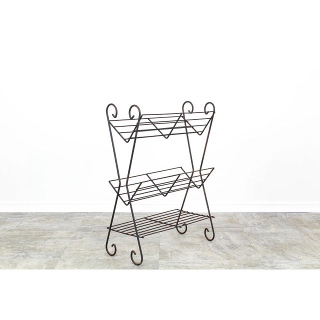 Mid century 3 tiered wired magazine rack Dimensions; 21"Width x 9"Depth x 28"Height Some wear, signs of age, paint loss If...