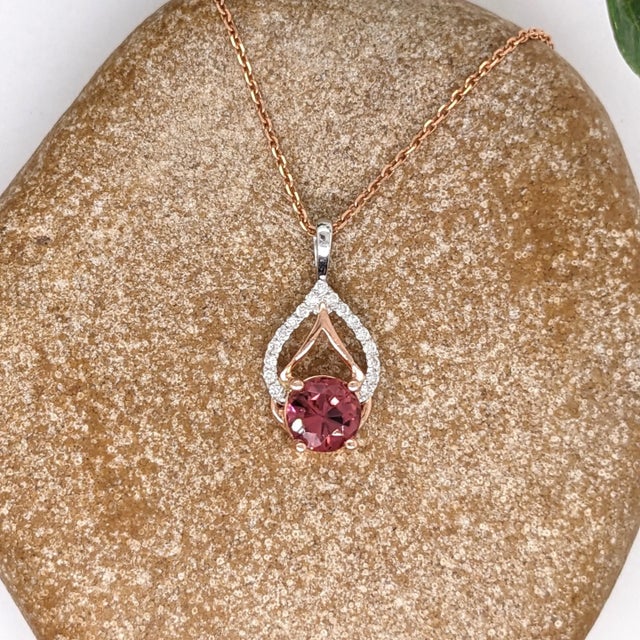 This beautiful pendant features a 0.79ct round pink tourmaline with natural earth-mined diamonds in solid 14k dual tone...