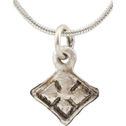 Silvered bronze of petite size, just under 1/2" in width. Diamond form with a four-point star within a raised border. At...
