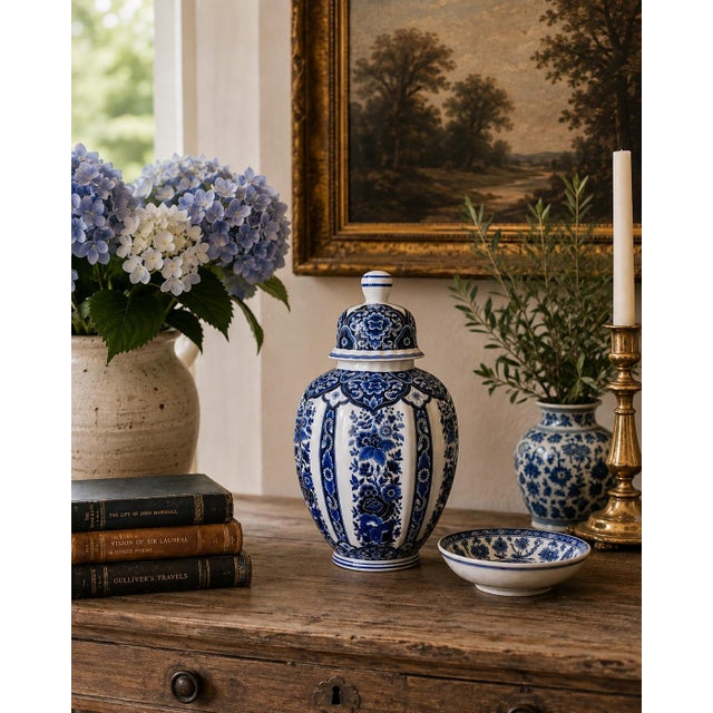 A richly decorated blue and white porcelain ginger jar by Ardalt's Blue Delfia line, crafted in Italy during the mid-20th...