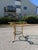 Hollywood regency style gilt iron two tiered side table. The table is in the style of Maison Ramsey. Dimensions: H: 29.25”...
