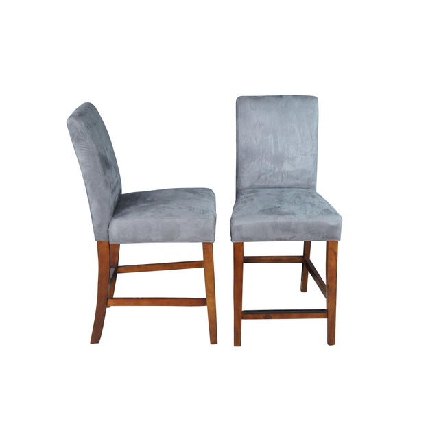 Set of four American Signature Counter Bar Stools, Circa 2017. Features a gray micro suede fabric over a mahogany finished...