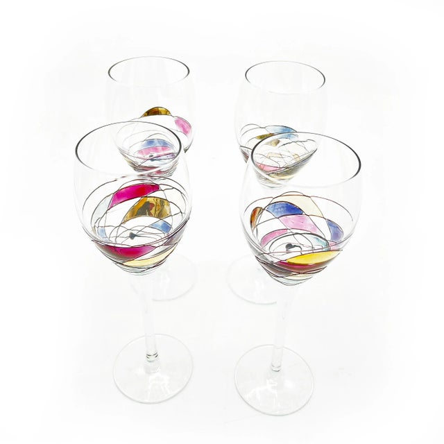 Sip in style with these tall and oversized, yet elegant hand painted crystal goblets. The bodies are elongated and sleek...