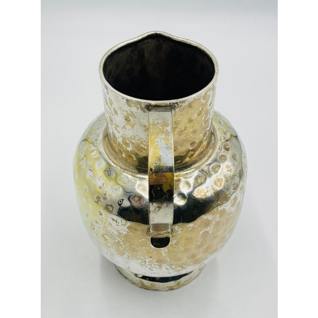 Striking vintage silver plated water pitcher designed and manufactured in Mexico circa the 1950s or earlier. The piece is...