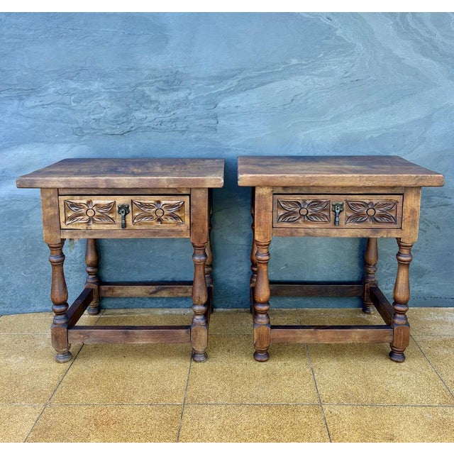 This charming pair of Spanish bedside tables dates from the mid-20th century and reflects the traditional rustic furniture...
