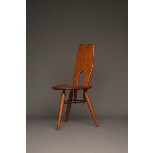 A very stylish solid oak organic formed side chair. Manufactured in Italy in the manner of Carlo Mollino in the 1950s....