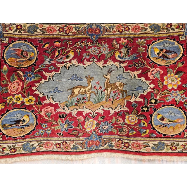 26” x 43” Wonderful hand knotted Persian Tabriz pictorial rug from the 3rd quarter of the 1900s. The Tabriz rug depicts a...