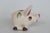 This darling Miniature Pig Figurine is made of ceramic. This lovely little pig presents a cozy mid-century folk art style;...