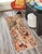 Enhance the ambiance of your home with this magnificent Persian-influenced Turkish hand-knotted rug made by skilled...