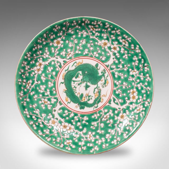 This is an antique Famille Verte display plate. An Oriental, ceramic Qing dynasty decorative saucer or dish, dating to the...