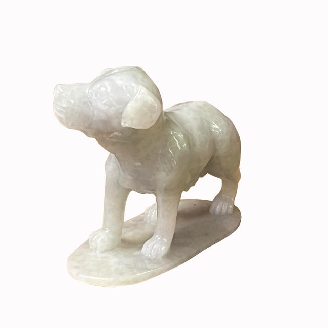 This is a Chinese accent decorative light green white jade color stone carved puppy dog figure. The stone has a very light...