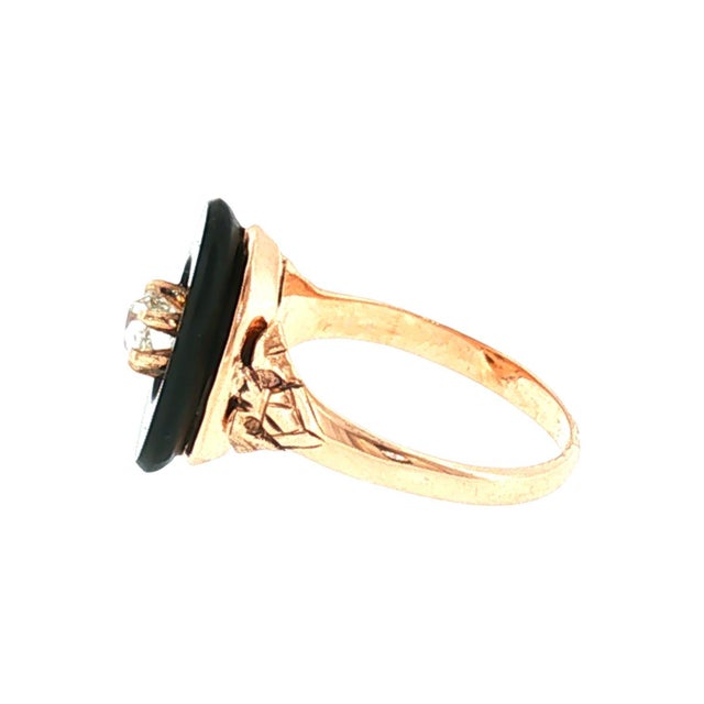 A 10k rosy-yellow gold Victorian ring featuring a 0.35 carat old mine-cut diamond, slightly included (SI3) with a J color...