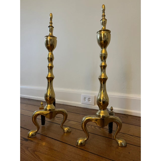Vintage pair of polished brass andirons. 22.5" high x 17" deep x 8" wide