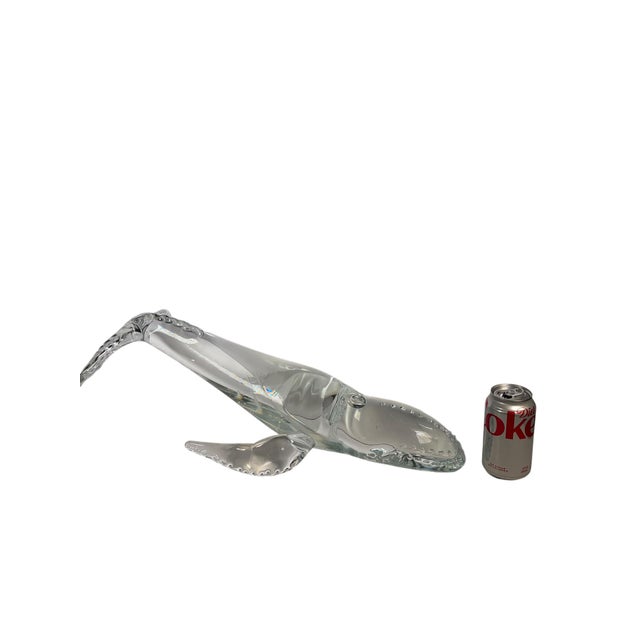 A striking and substantial vintage crystal whale sculpture, masterfully executed in clear crystal with exceptional clarity...