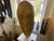 20th century sculpture on column stand by artist Nick Santoro. Carved wood figure, raw wood. Mounted to stand, wood...