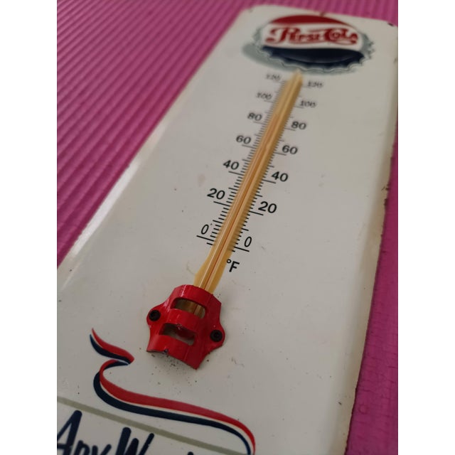 Capture the true essence of mid-century Americana with this exquisite Vintage-Style Pepsi-Cola Metal Thermometer Sign....