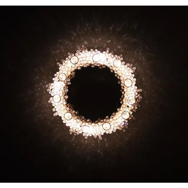 Stunning Chrystal wall lamp including mirror . Hollywood Regency in style . Back lid by 4 small sockets bulbs . Gives a...