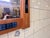 This large Danish mirror features a warm teak frame beautifully inlaid with handcrafted blue tiles, creating a refined and...