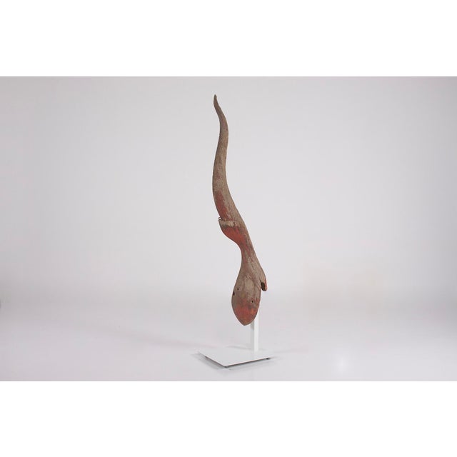 Antique chofa or (chof ​​ah) in carved wood and representing the mythical bird garuda, vehicle of the god vishnu. In thai...