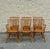 A set of six vintage Windsor-style dining chairs, including four side chairs and two armchairs. Crafted from solid wood,...