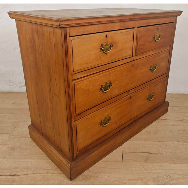 This is a gorgeous pine chest of drawers, with exquisite and timeless Victorian qualities. Circa 1890. Displaying an...