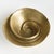 Made of a substantial cast aluminum and finished in a warmGold, the real story is the spirral cavity of this unique bowl....