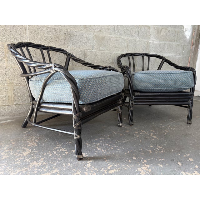 A Pair of Vintage Bohemian / Coastal Stylle Rattan Lounge Chairs crafted by McGuire in the California organic modern...