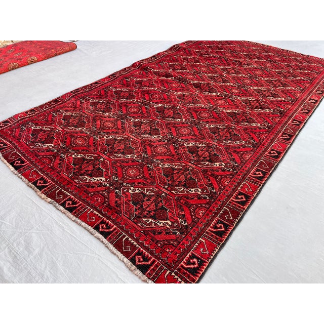 A vintage Afghan Beshir (Bashiri) Turkmen rug in the tribe's collectible ikat-inspired style — a bold interlocked lattice...