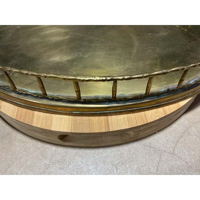 Bring classic Hollywood Regency flair to your bar cart or coffee table with this substantial vintage oval brass tray....