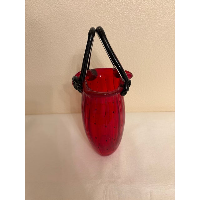Add a sweet touch of playful sophistication to your collection with this vintage Block Crystal hand-blown art glass purse...