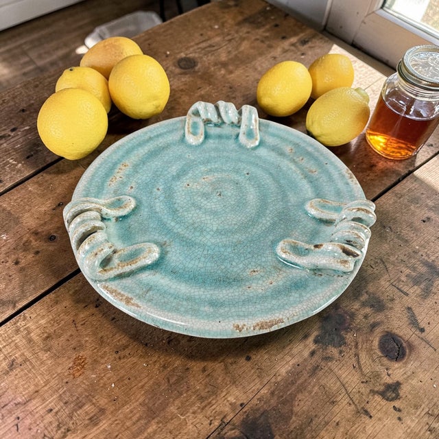Handmade Southwest studio pottery platter featuring a luminous turquoise crackle glaze with sculptural loop handles and an...