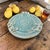 Handmade Southwest studio pottery platter featuring a luminous turquoise crackle glaze with sculptural loop handles and an...
