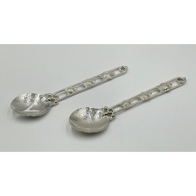 Rare and whimsical pair of handcrafted silver-plated serving utensils designed by celebrated Mexican artist Emilia...