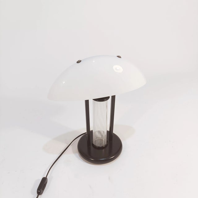 Italian murano glass table or table lamp, 1980s. Postmodern style, the body of this lamp is made up of a black lacquered...