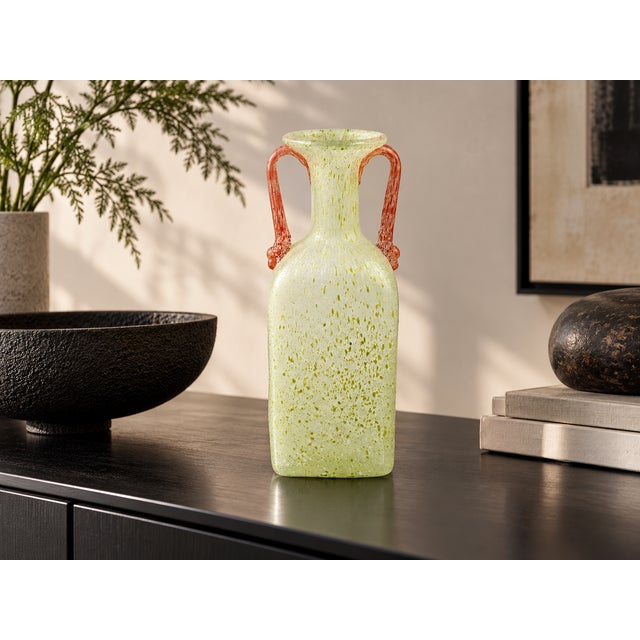 An exceptional vintage glass amphora made of delicate green speckled art glass with two artfully attached, coral-red...