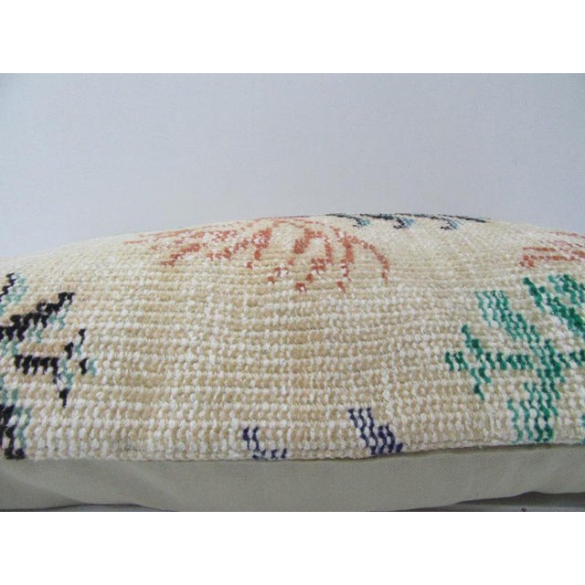 This is a pillow cover made from a vintage kilim rug. The piece was properly washed and ready to use. Pillow inserts not...