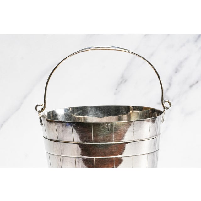 A charming example of early twentieth-century English barware, this circa 1905 silverplate ice bucket is an outstanding...