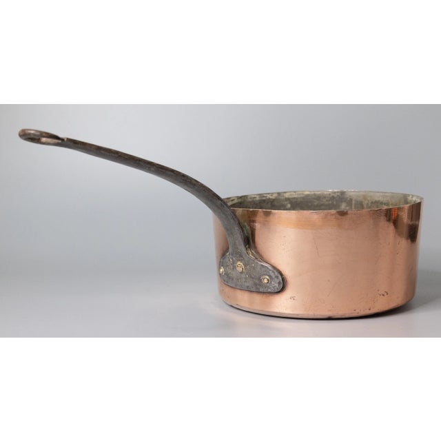 A gorgeous antique 19th-Century French hand forged copper pot or saucepan. This fine quality pot is large and heavy with a...