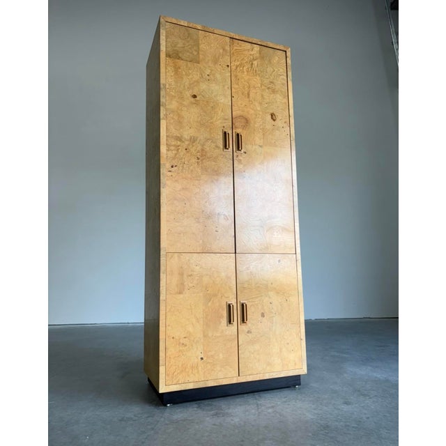This postmod burl cabinet is the perfect piece to extend your collection or to start mapping out a new space. Ample...