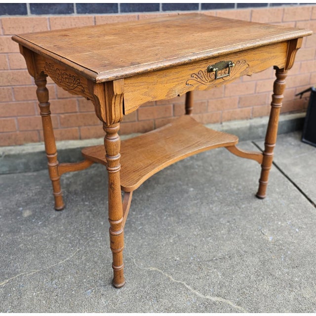19th Century Oak Single Drawer Work Table. Measures 34" in width, 23.5" in depth and stands 29" tall. Knee clearance is...