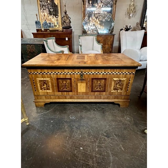 Exceptional 19th century German Biedermeier inlaid walnut trunk. Circa 1850. Adds warmth and charm to any room!