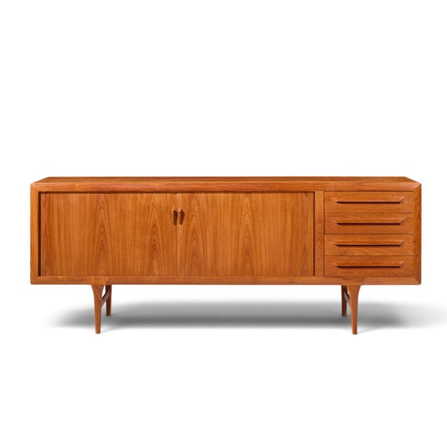 Kofod-Larsen for Faarup Møbelfabrik Mid Century Danish Teak Tambour Door Credenza This credenza measures: 86.75 wide x...