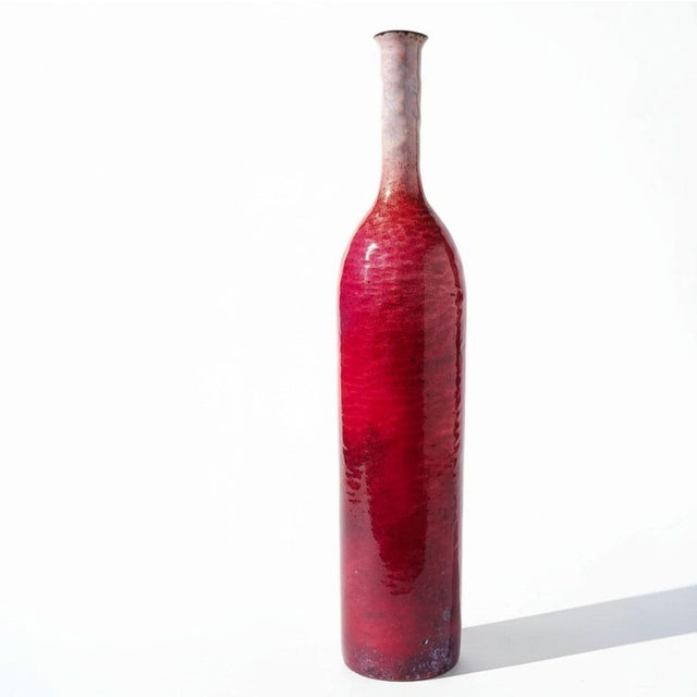 Bottle-shaped vase in copper with an enamelled surface by Paolo De Poli. The color gradient transitions gracefully from...