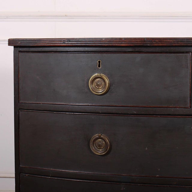 Early 19th C English painted bowfront oak chest of drawers. 1820 This piece is designed in the style of the selected...