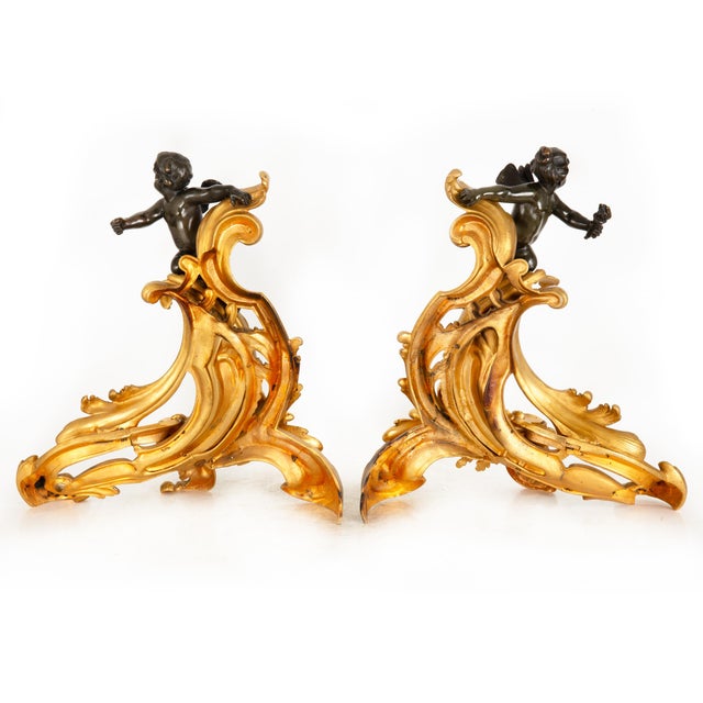 PAIR OF GILT AND PATINATED FIGURAL FIREPLACE CHENETS Paris, late 19th century Marked "CC" verso 18" H x 16 1/4" W x 6 1/2"...