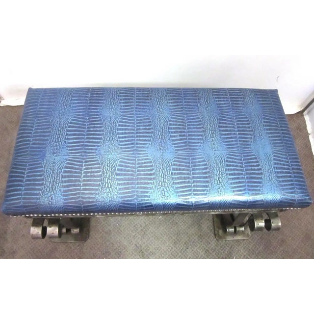 French Art Deco iron bench with elaborate scrolling ornamentation and heavy details. The bench was recently upholstered in...